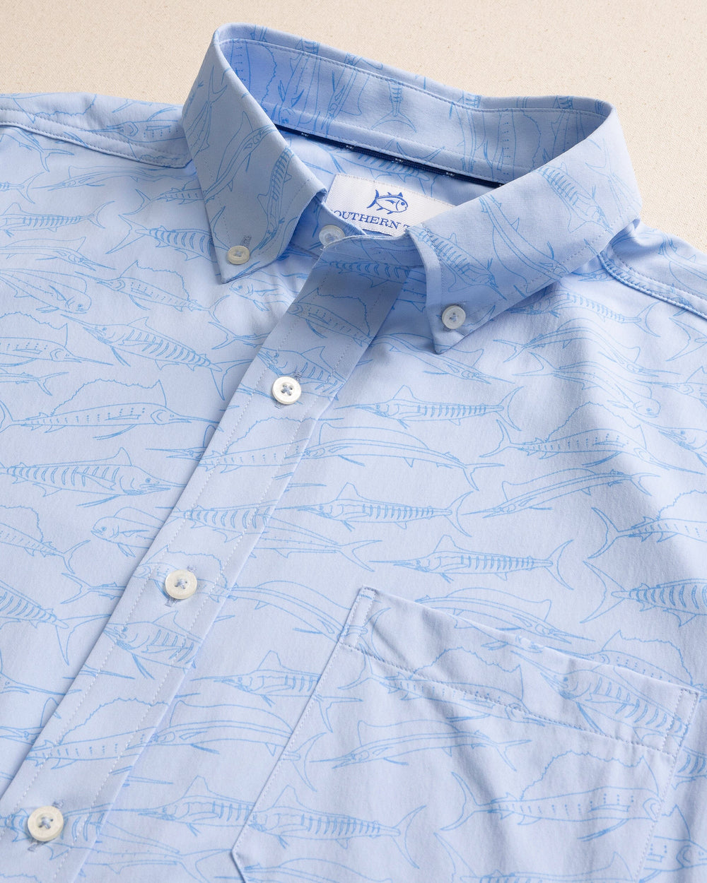 The detail view of the Southern Tide Game Fish Intercoastal Short Sleeve Sport Shirt by Southern Tide - Cerulean