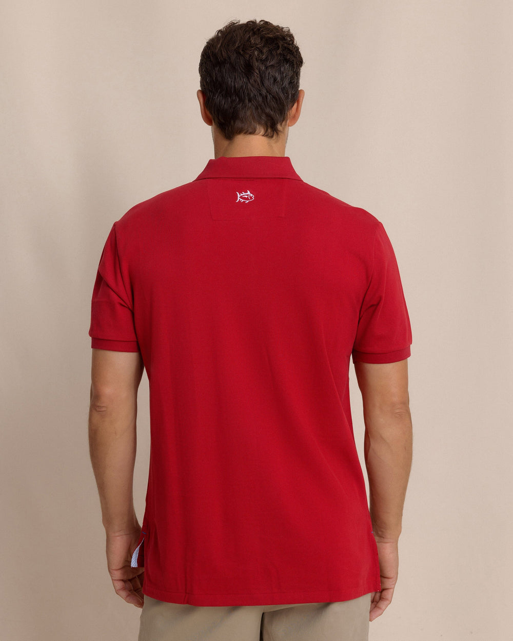 The back view of the Southern Tide Skipjack Gameday Colors Polo Shirt by Southern Tide - Crimson