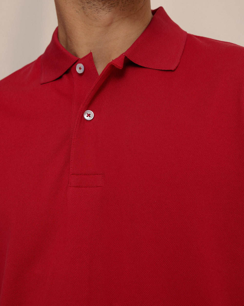 The detail view of the Southern Tide Skipjack Gameday Colors Polo Shirt by Southern Tide - Crimson