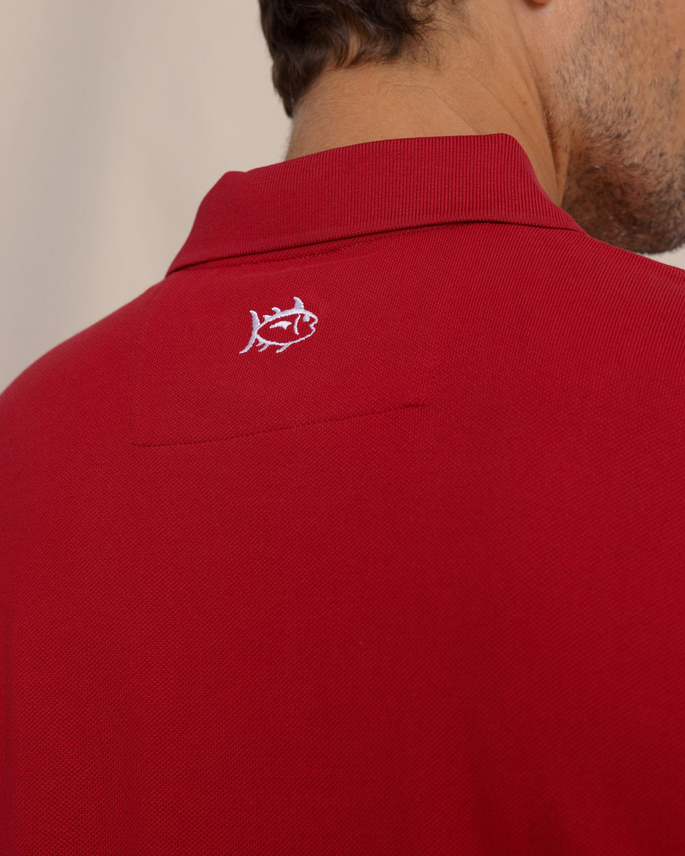 The detail view of the Southern Tide Skipjack Gameday Colors Polo Shirt by Southern Tide - Crimson
