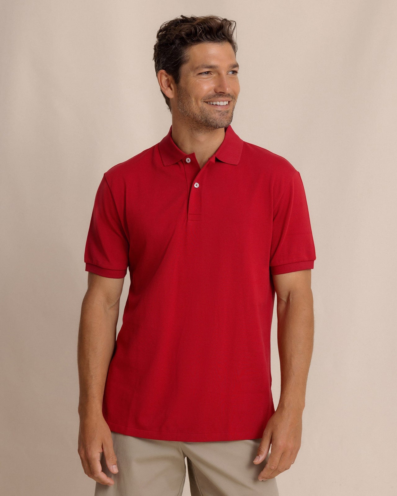The front view of the Southern Tide Skipjack Gameday Colors Polo Shirt by Southern Tide - Crimson