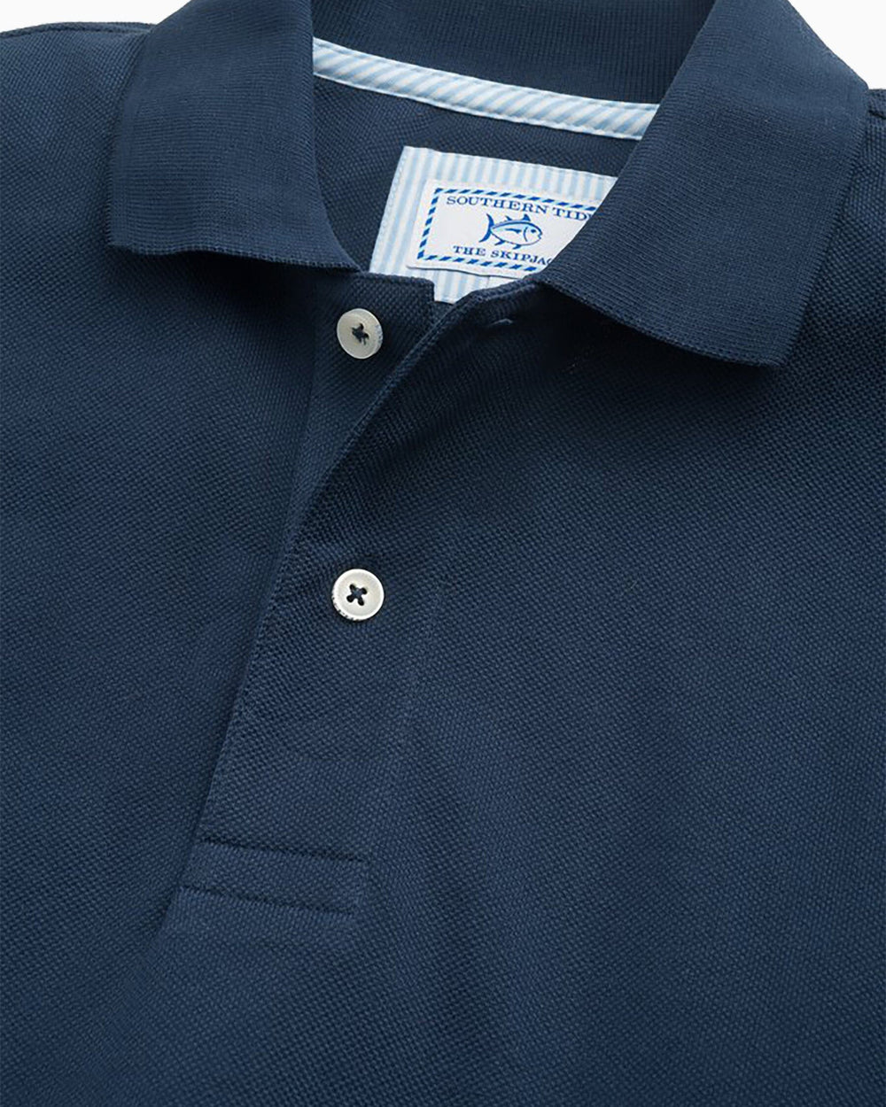 The detail view of the Men's Orange Skipjack Gameday Colors Polo Shirt by Southern Tide - Navy