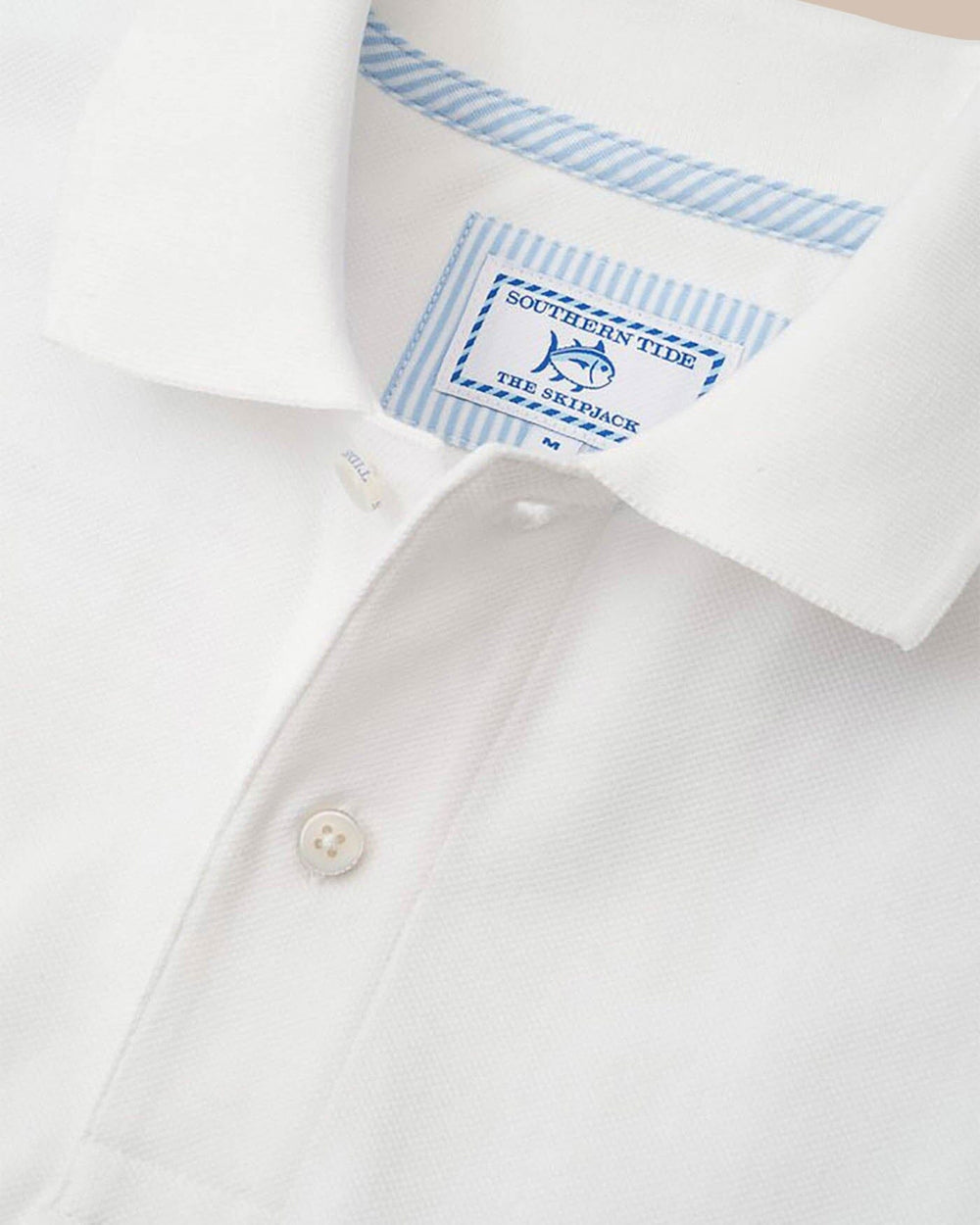 The detail of the Men's White Alabama Crimson Tide Pique Polo Shirt by Southern Tide - Classic White