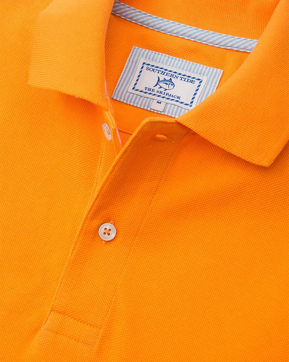 The detail view of the Men's Orange Skipjack Gameday Colors Polo Shirt by Southern Tide - Rocky Top Orange