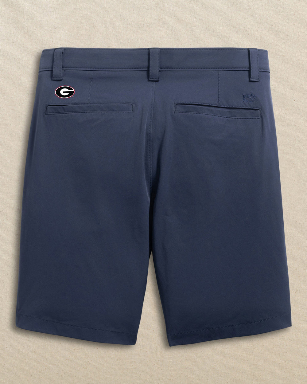 The back view of the Southern Tide Georgia Bulldogs Oval G Birdie 8" Coastal Breeze® Performance Short by Southern Tide - True Navy
