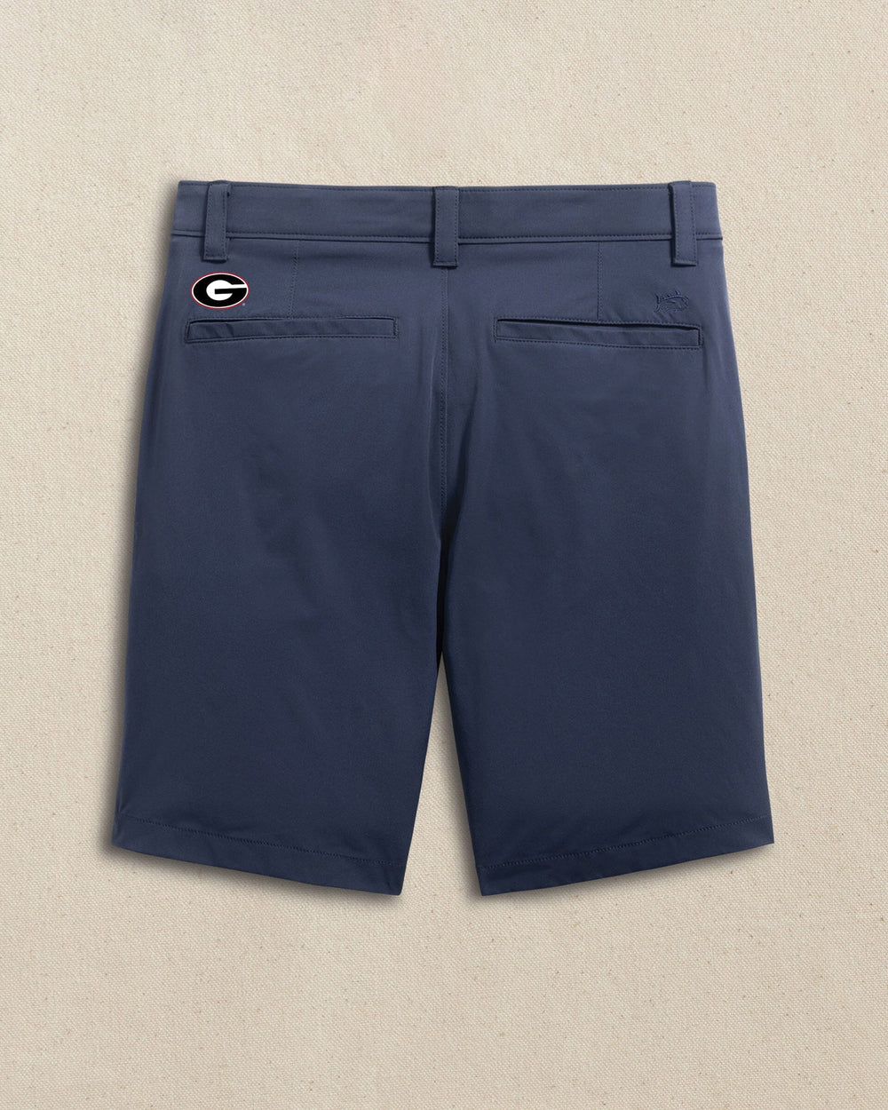 The back view of the Southern Tide Georgia Bulldogs Oval G brrr°®-die 8" Performance Short by Southern Tide - True Navy