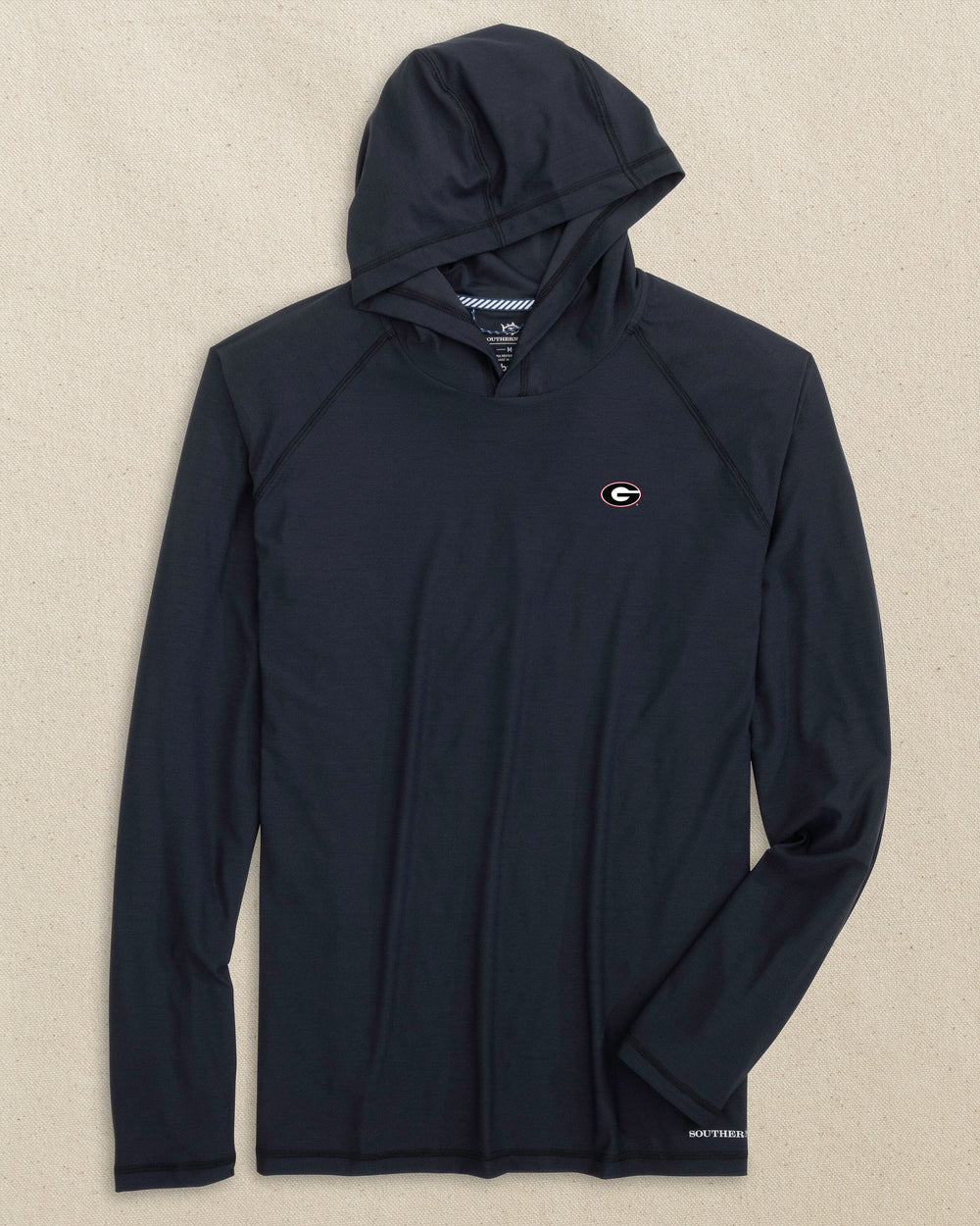 The front view of the Southern Tide Georgia Bulldogs Oval G brrr°®-illiant Performance Hoodie by Southern Tide - Caviar Black