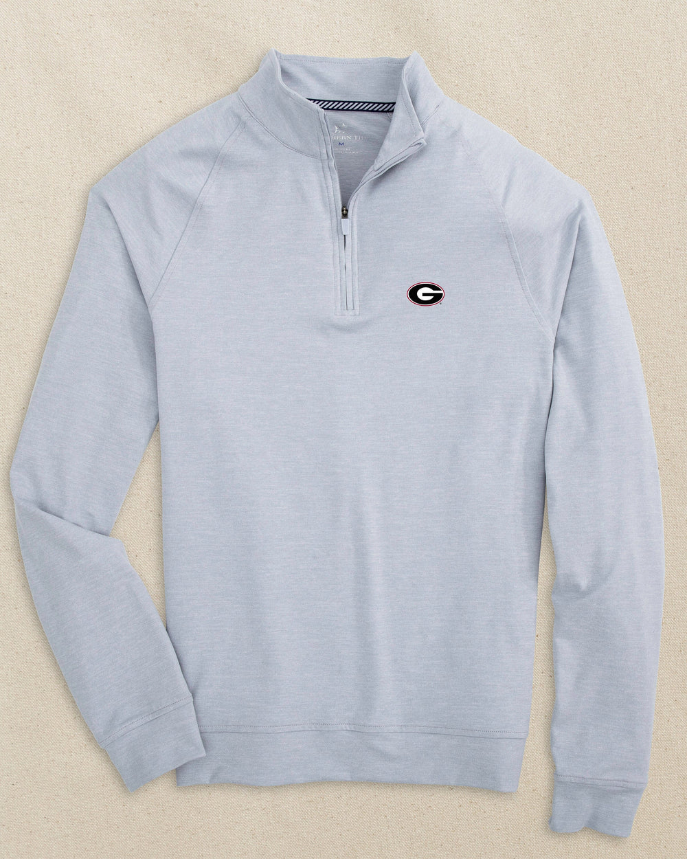 The front view of the Southern Tide Georgia Bulldogs Oval G Cruiser Quarter Zip by Southern Tide - Heather Slate Grey