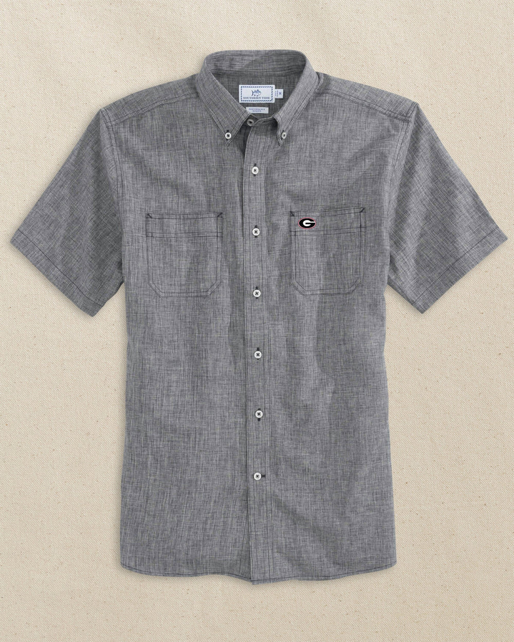 The front view of the Southern Tide Georgia Bulldogs Oval G Short Sleeve Button Down Dock Shirt by Southern Tide - Polarized Grey