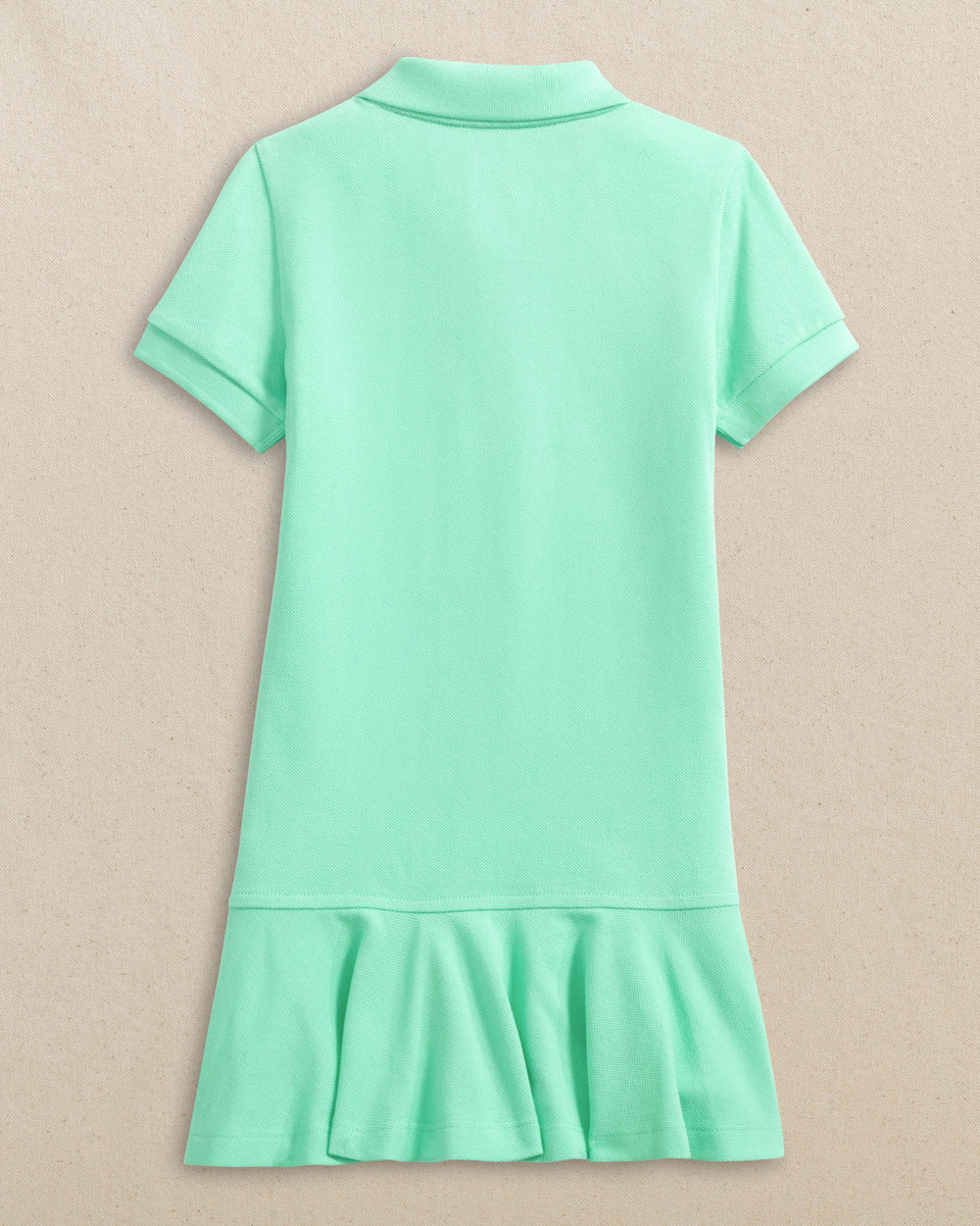 The back view of the Southern Tide Girls Skipjack Dropwaist Polo Dress by Southern Tide - Gulf Shores