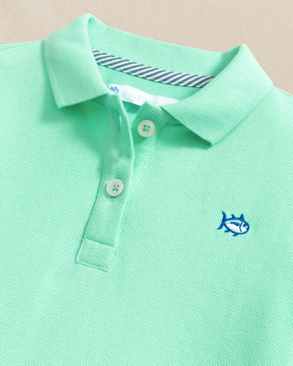 The detail view of the Southern Tide Girls Skipjack Dropwaist Polo Dress by Southern Tide - Gulf Shores