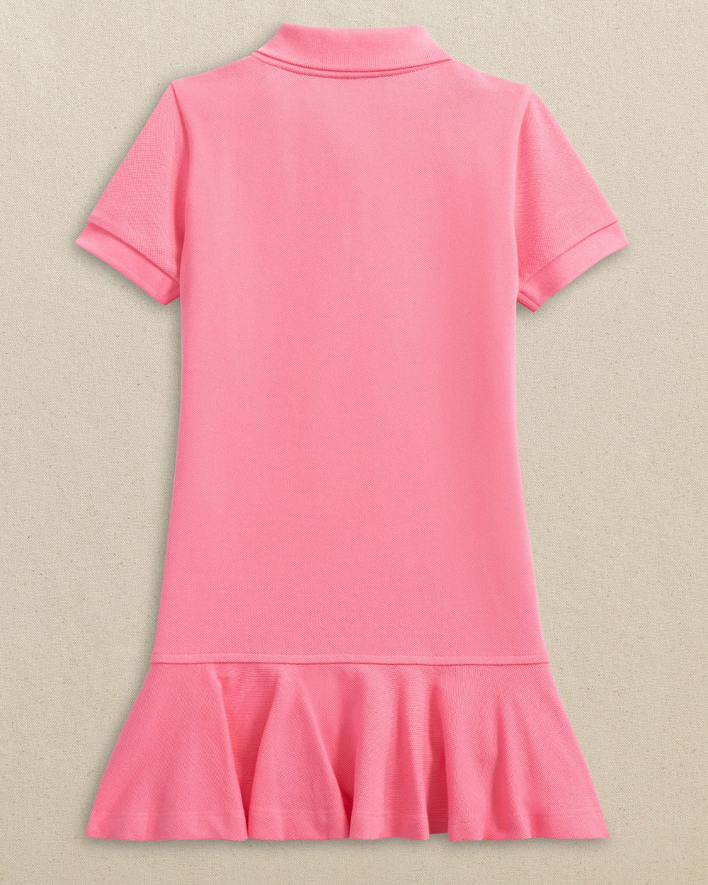 The back view of the Southern Tide Girls Skipjack Dropwaist Polo Dress by Southern Tide - Sea Pink
