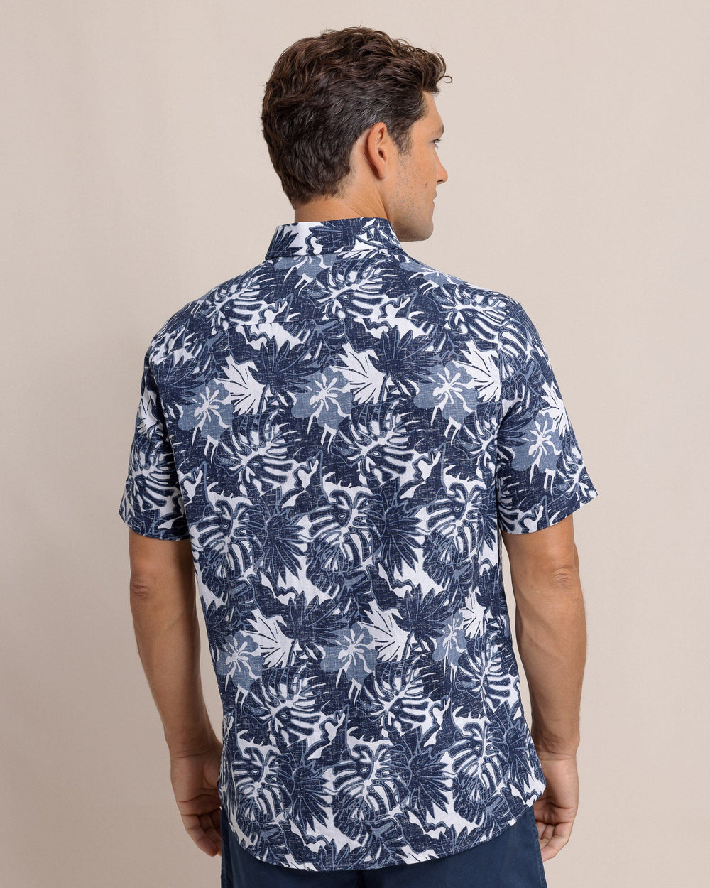 The back view of the Southern Tide Grand Palms Linen Rayon Short Sleeve Sport Shirt by Southern Tide - Dress Blue