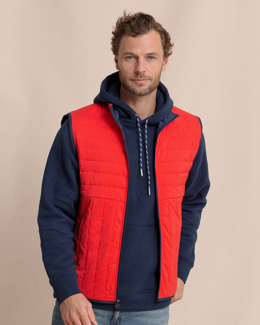 The front view of the Southern Tide Greenwood Packable Quilted Vest by Southern Tide - Crab Red