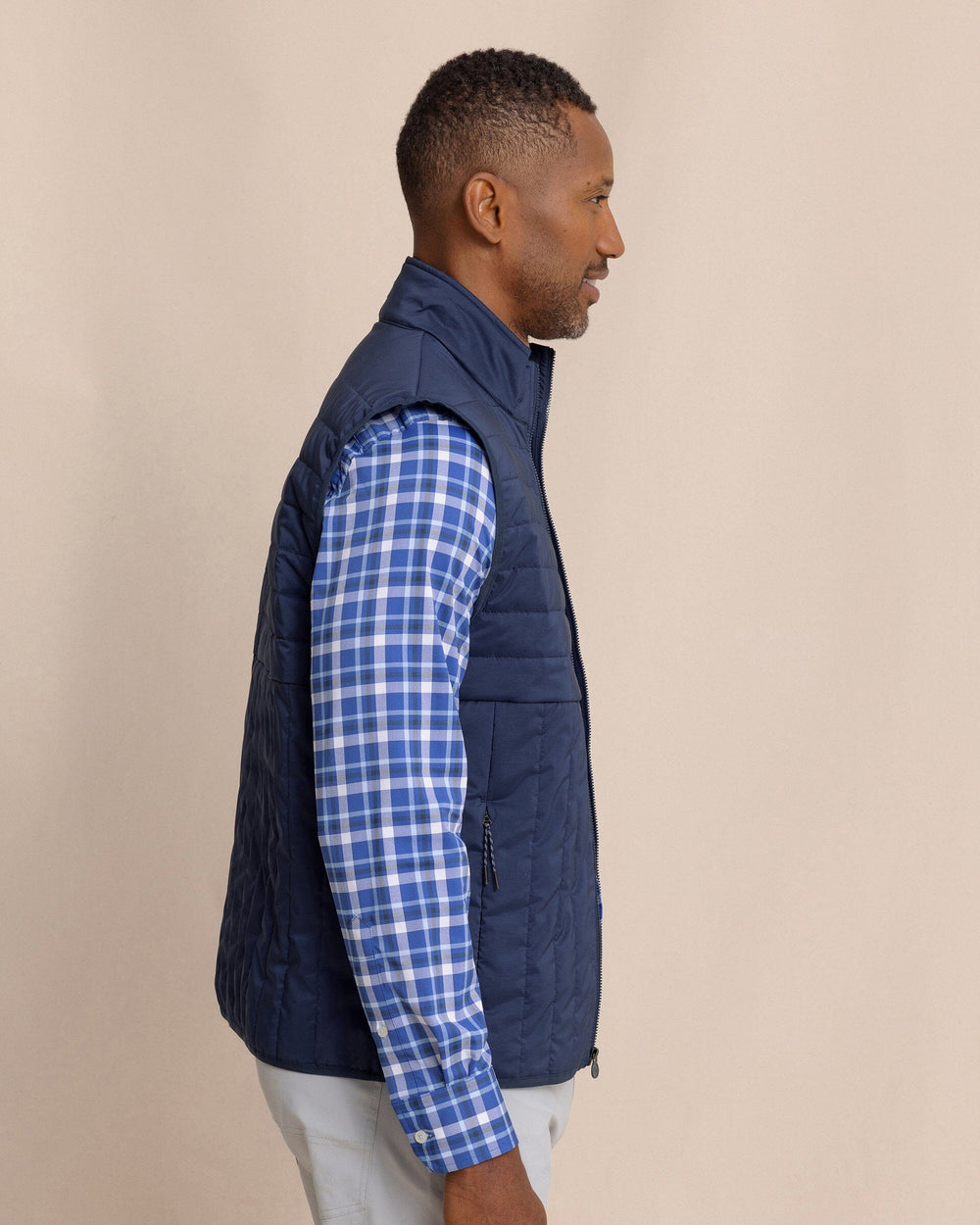 The side view of the Southern Tide Greenwood Packable Quilted Vest by Southern Tide - Dress Blue