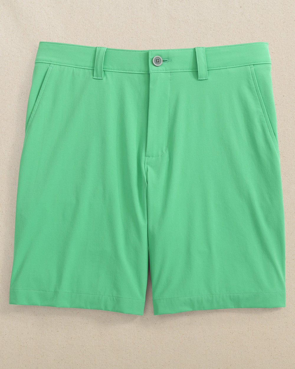 The front laydown view of the Southern Tide brrr-die 8in Performance Short by Southern Tide - Jade Green