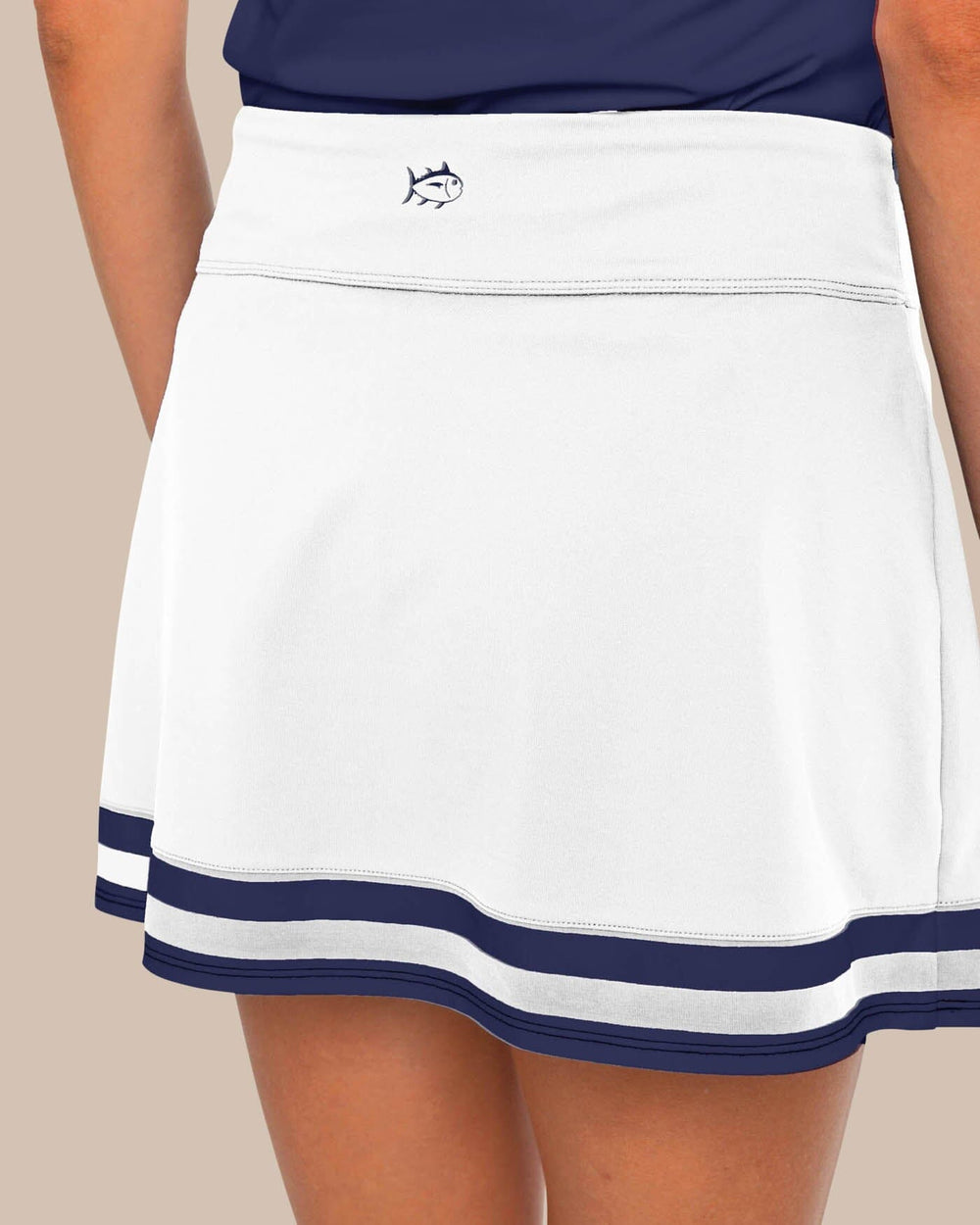 The back view of the Southern Tide Gwen Pleated Performance Skort by Southern Tide - Classic White