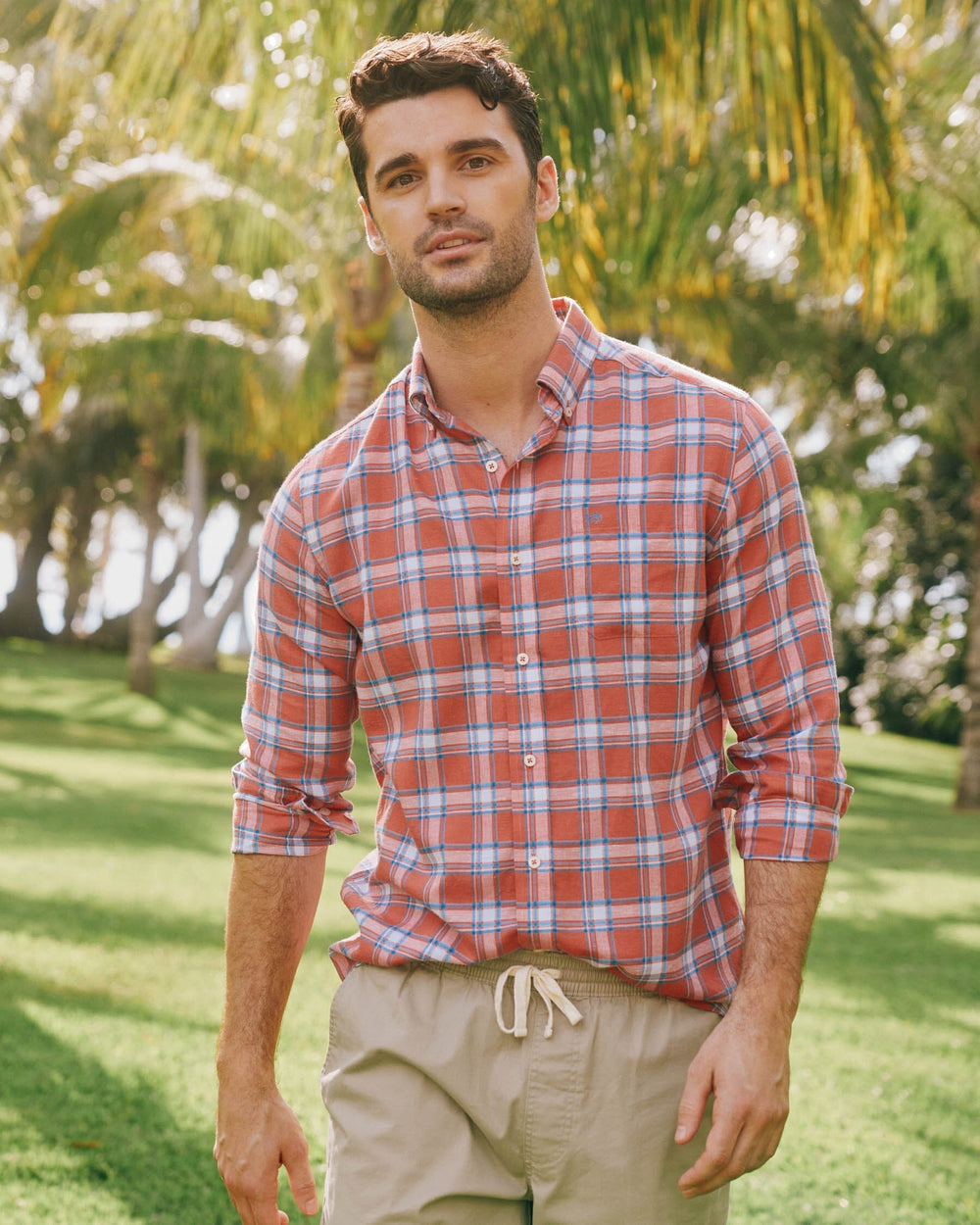 The lifestyle view of the Southern Tide Headland Bayfront Plaid Long Sleeve Buttom Down Sport Shirt - Mineral Red