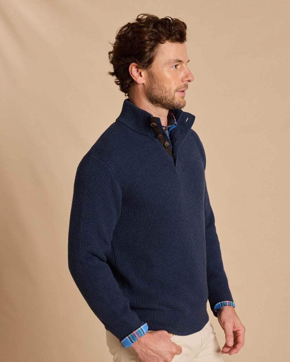 The side view of the Southern Tide Heather Quarter Button Sweater by Southern Tide - Heather Dress Blue