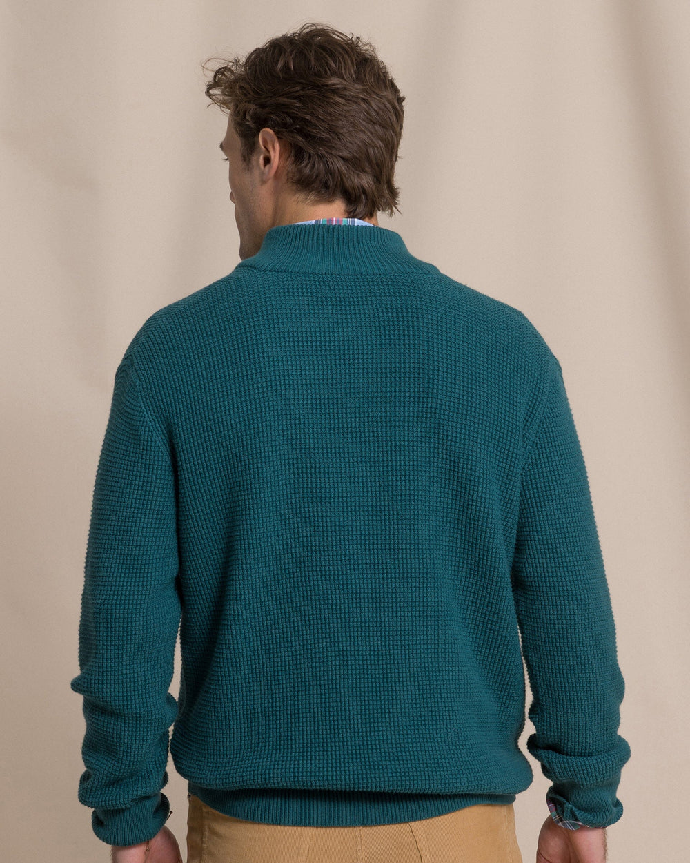 The back view of the Southern Tide Heather Quarter Button Sweater by Southern Tide - Heather Salt Meadow
