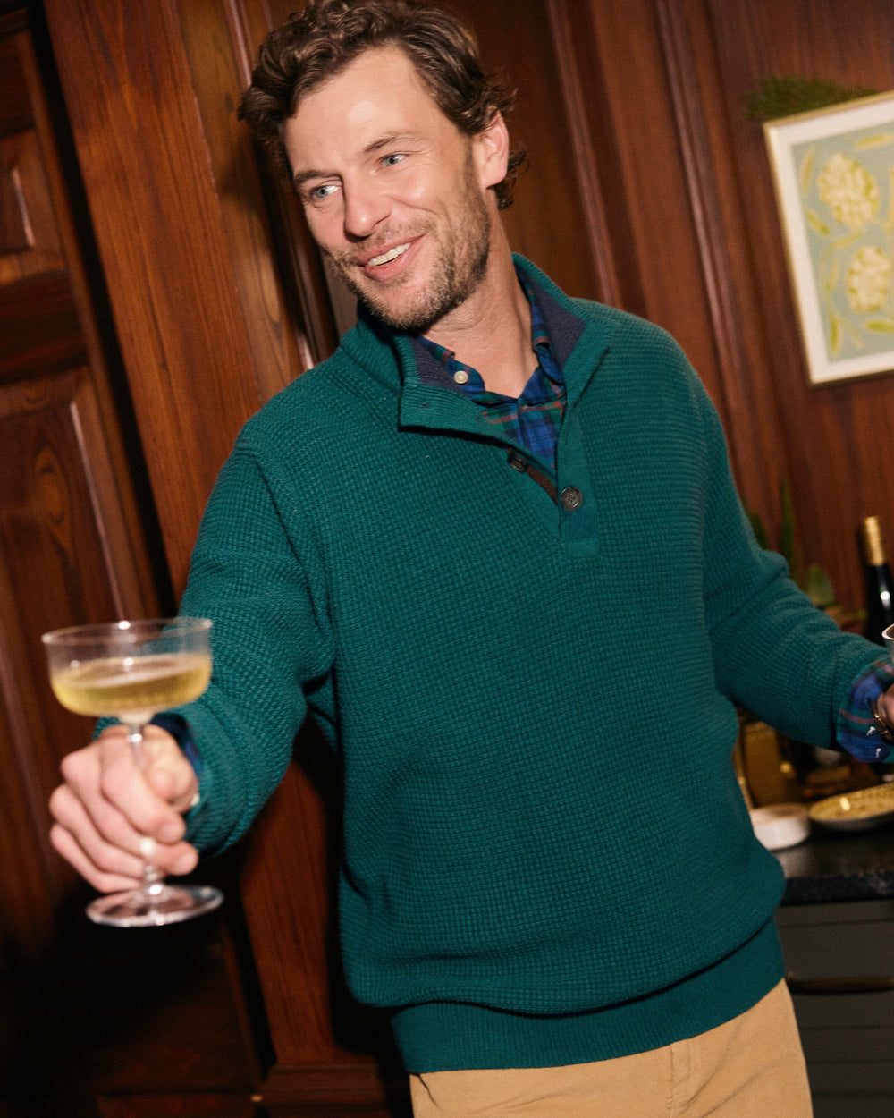 The lifestyle view of the Southern Tide Heather Quarter Button Sweater by Southern Tide - Heather Salt Meadow