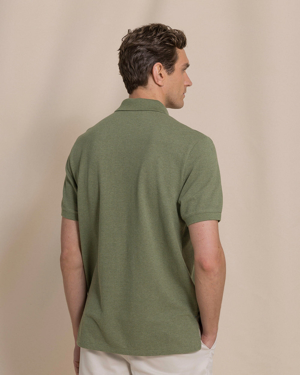 The back view of the Southern Tide Heather Skipjack Polo by Southern Tide - Heather Cedar Green