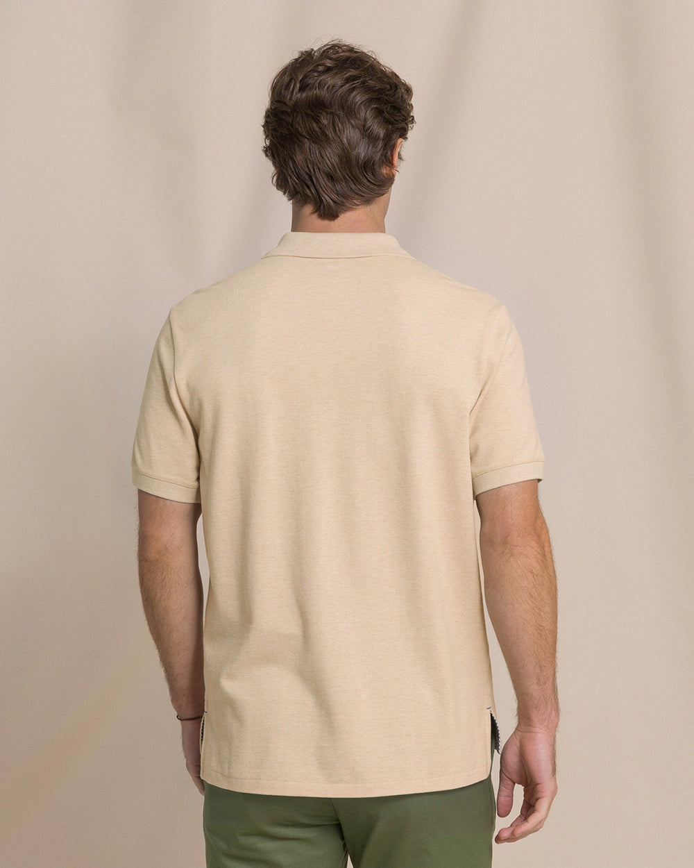 The back view of the Southern Tide Heather Skipjack Polo by Southern Tide - Heather Sand Dunes