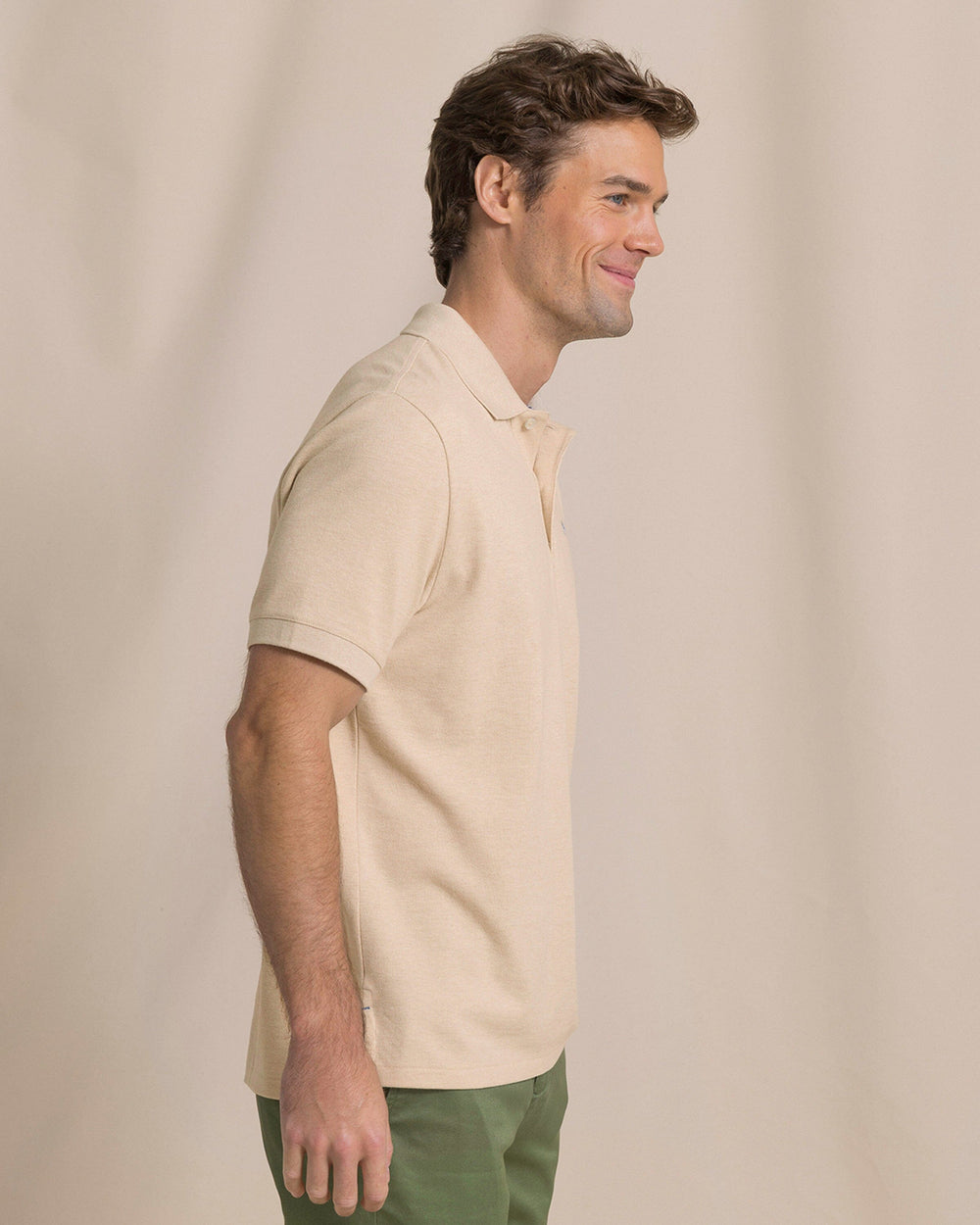 The side view of the Southern Tide Heather Skipjack Polo by Southern Tide - Heather Sand Dunes