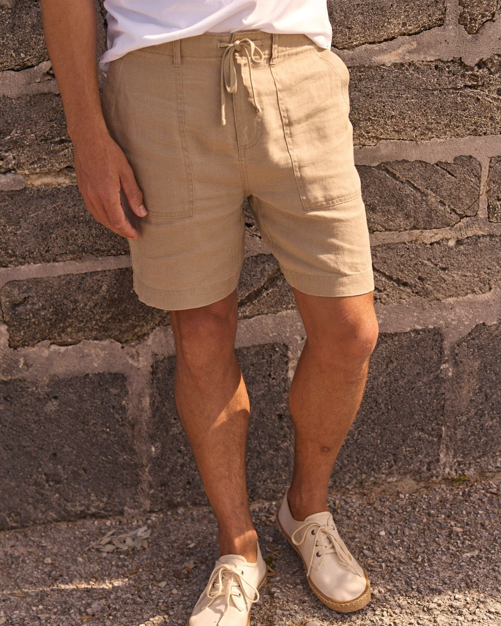 The lifestyle view of the Southern Tide Heritage Preserve Linen Short by Southern Tide - Sandstone Khaki
