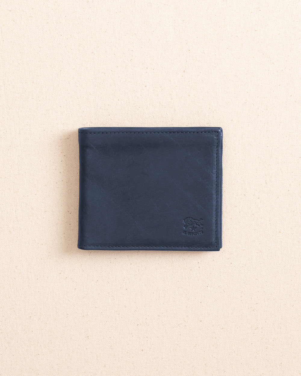 The open view of the Il Bisonte Classic Bifold Wallet at Southern Tide - Blue Mezzanotte