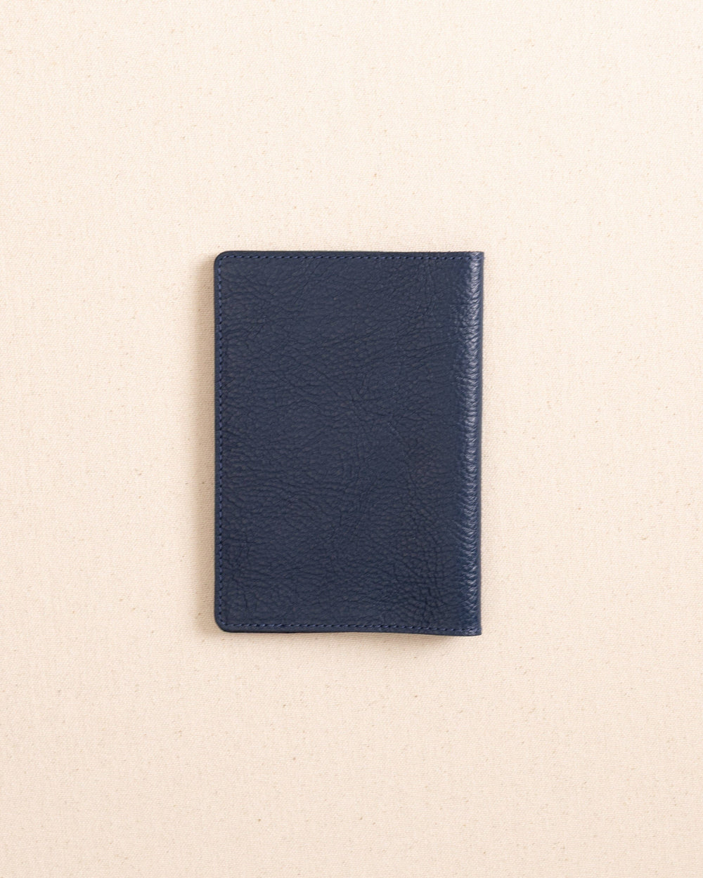The back view of the Il Bisonte Passport Case at Southern Tide - Blue