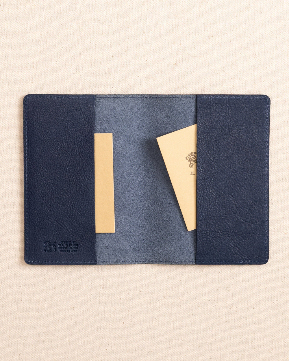 The inside view of the Il Bisonte Passport Case at Southern Tide - Blue