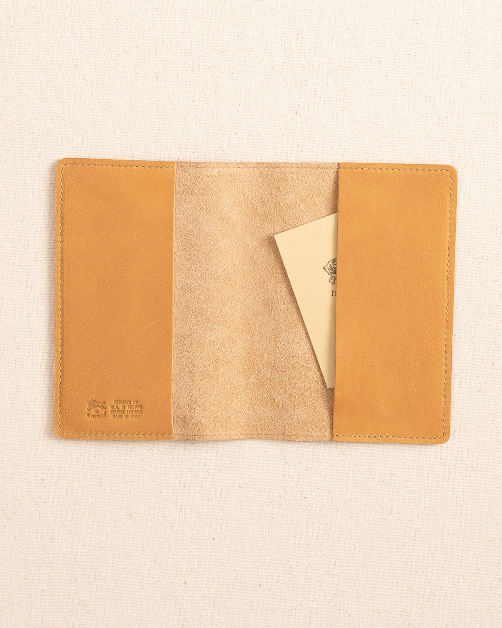 The inside view of the Il Bisonte Passport Case at Southern Tide - Natural