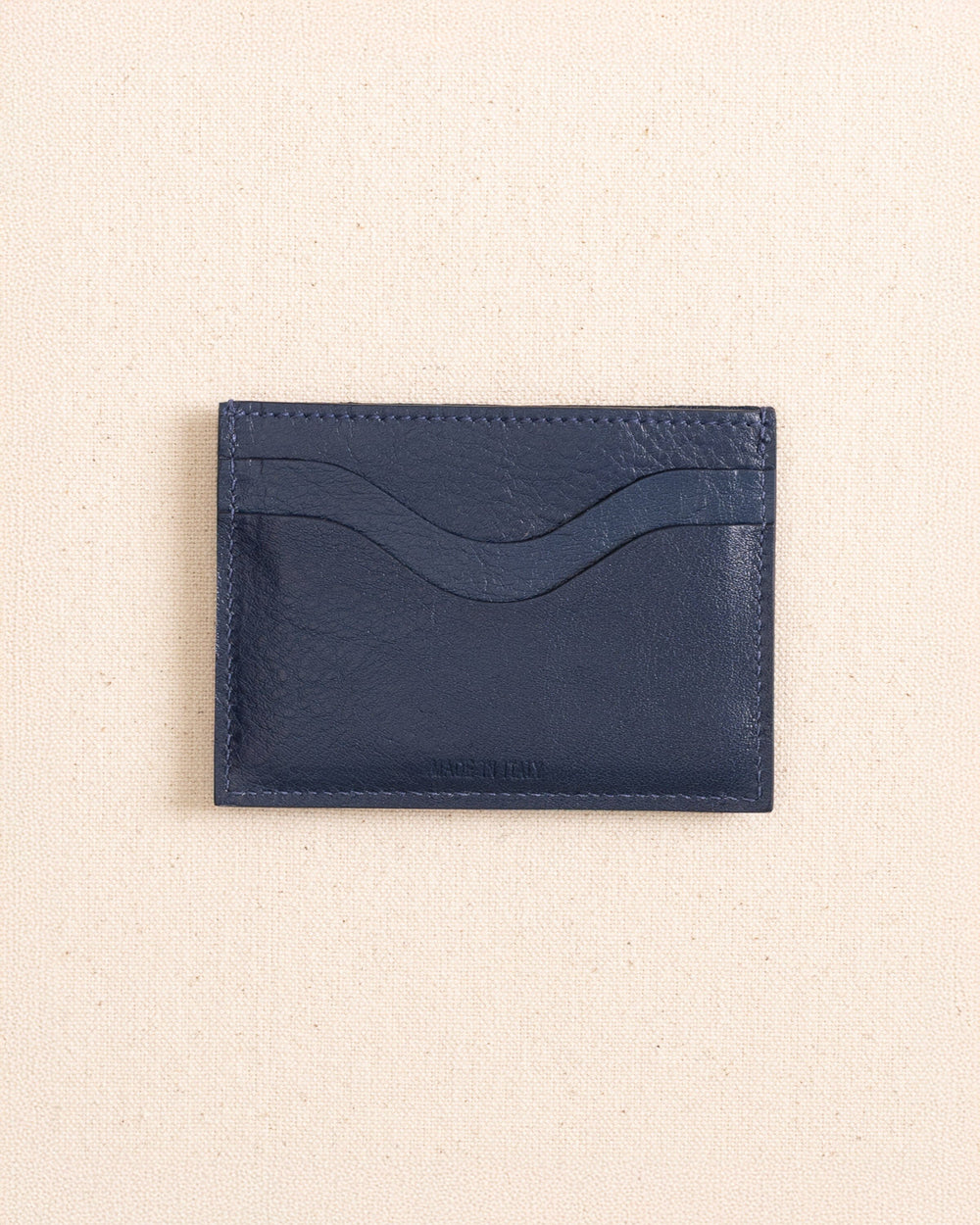 The back view of the Il Bisonte Salina Card Case at Southern Tide - Blue