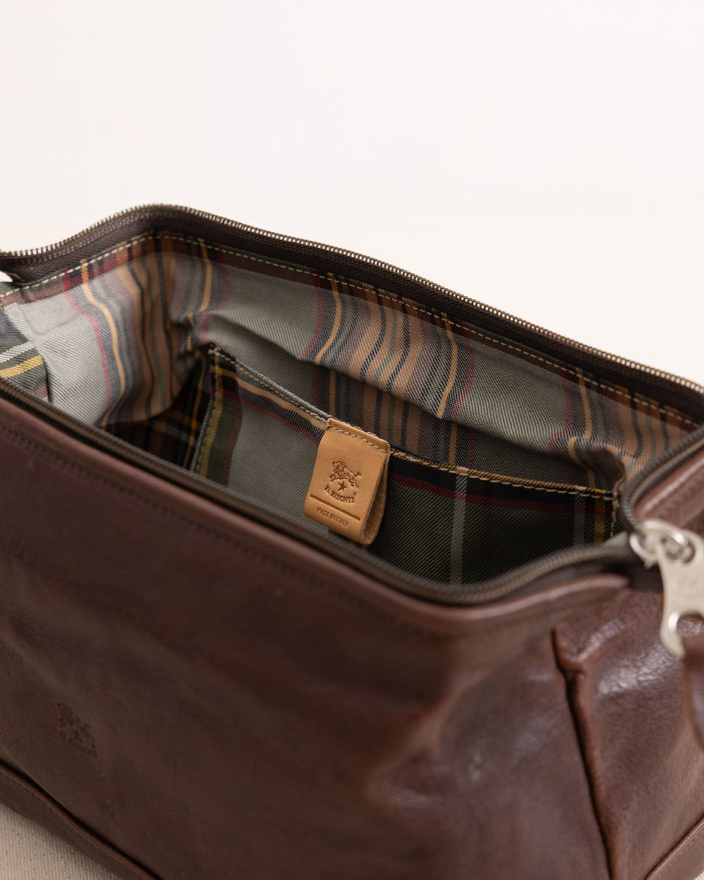 The detail view of the Il Bisonte Travel Bag at Southern Tide - Coffee