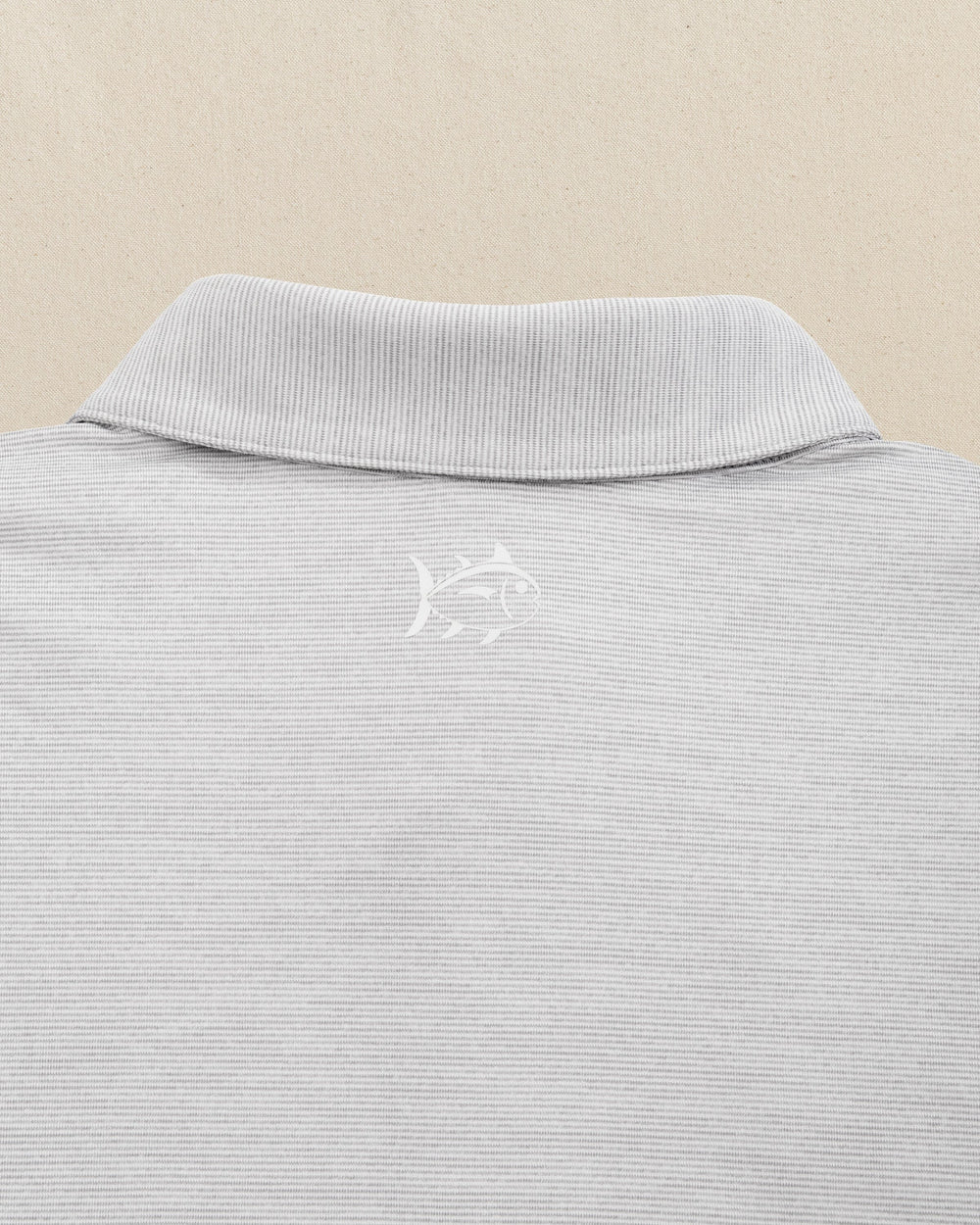 The detail view of the Southern Tide Iowa Hawkeyes Driver Spacedye Polo by Southern Tide - Slate Grey