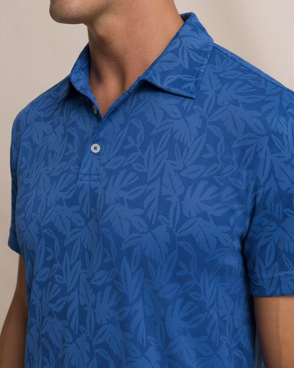 The detail view of the Southern Tide Island Fronds Jacquard Polo by Southern Tide - Nautical Blue