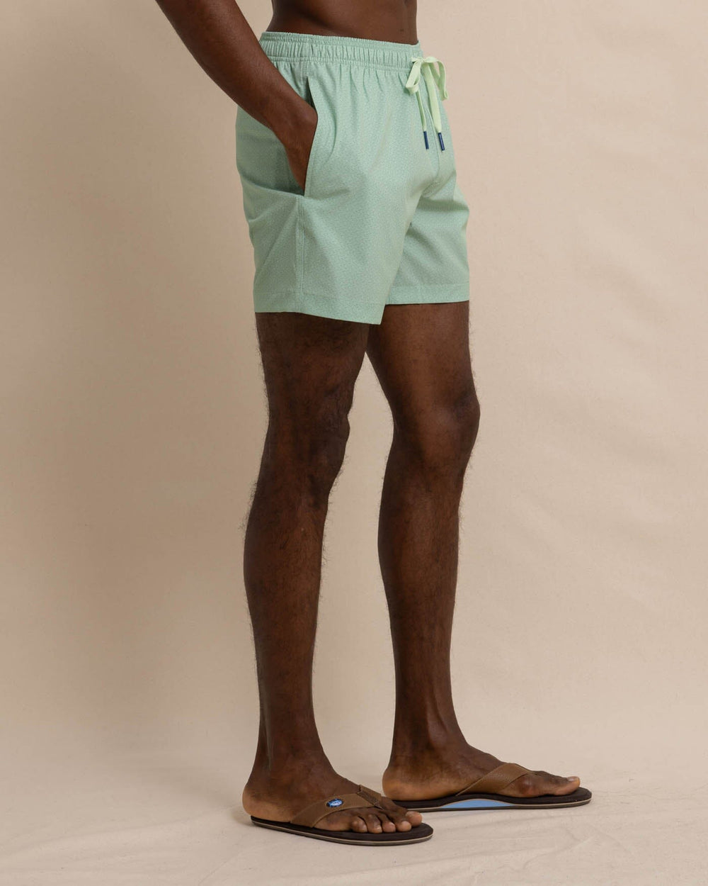 The front view of the Southern Tide It's Wavey Baby Swim Trunk by Southern Tide - Basil Green
