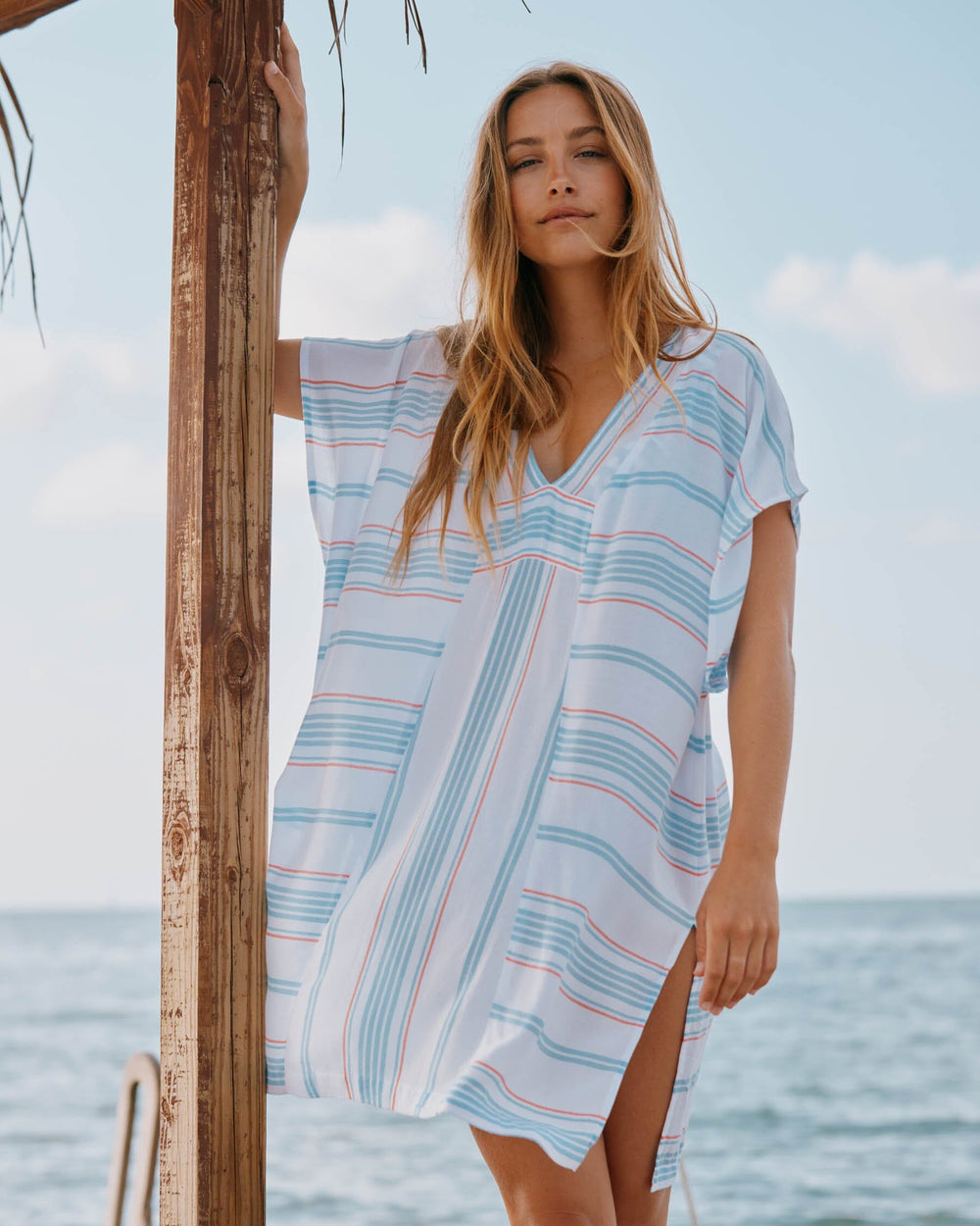 The lifestyle view of the Southern Tide Kamilia Beach Bliss Stripe Caftan by Southern Tide - Sky Blue