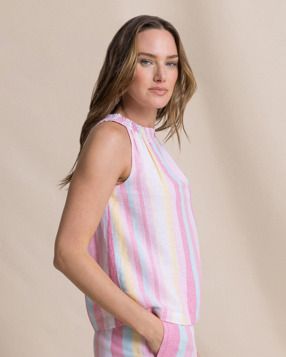 The side view of the Southern Tide Karlea Smocked Neck Blouse by Southern Tide - Island Pink