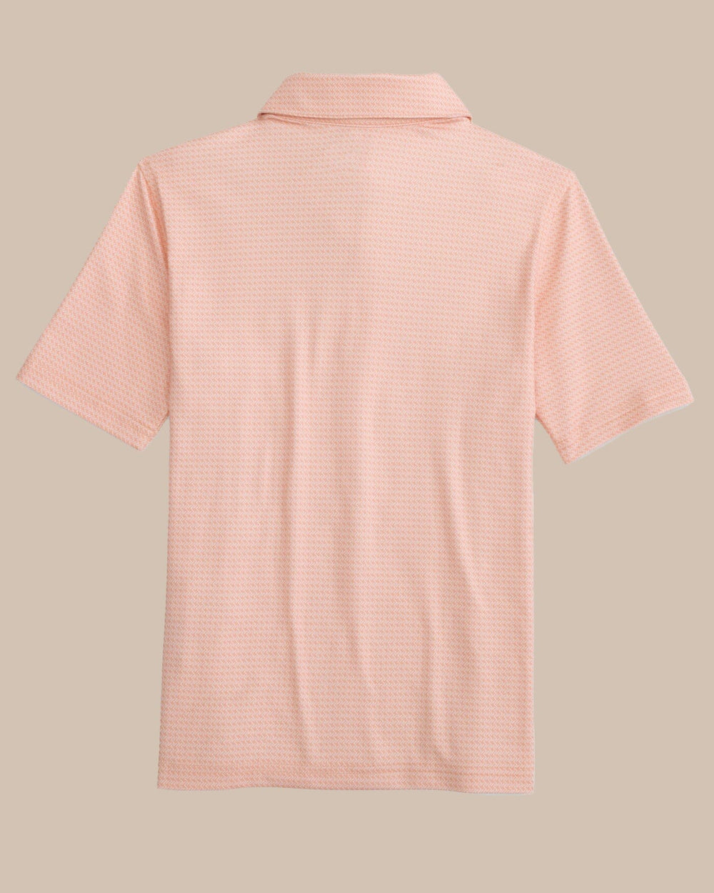The back view of the Southern Tide Kids Driver Getting Ziggy With It Printed Polo by Southern Tide - Apricot Blush Coral
