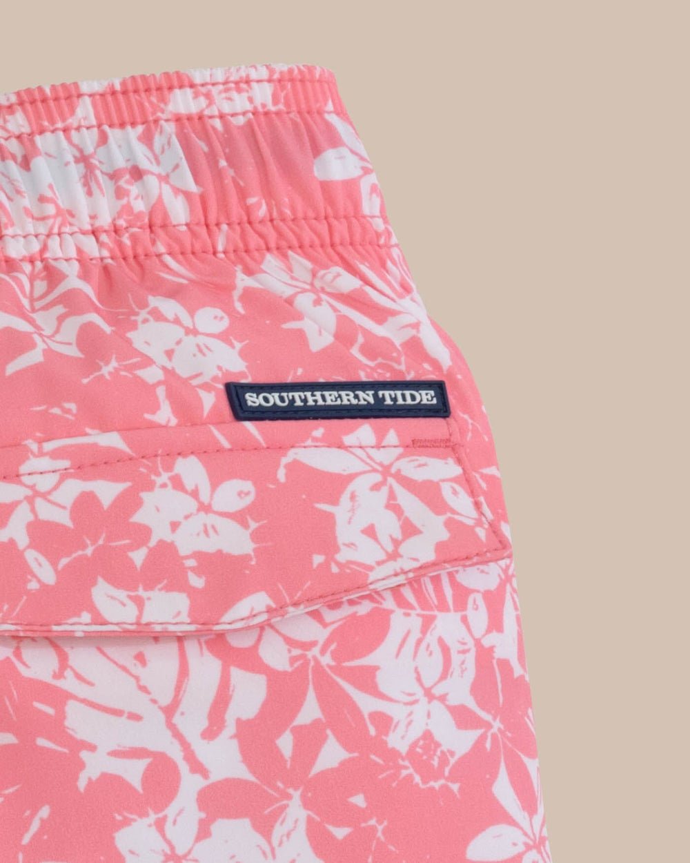 The detail view of the Southern Tide Kids Island Blooms Swim Trunk by Southern Tide - Geranium Pink