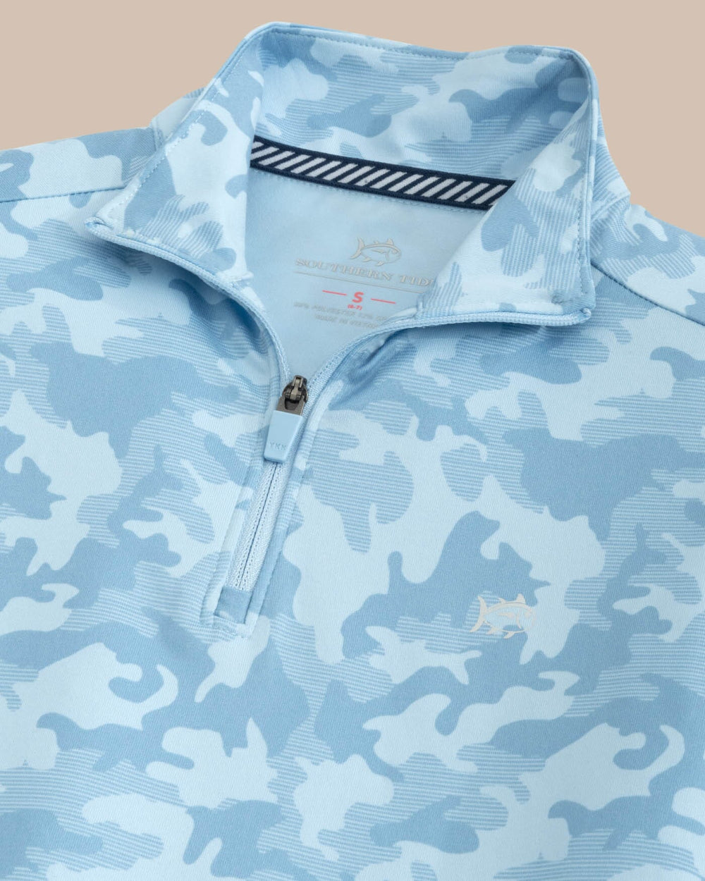 The detail view of the Southern Tide Kids Island Camo Print Cruiser Quarter Zip by Southern Tide - Clearwater Blue