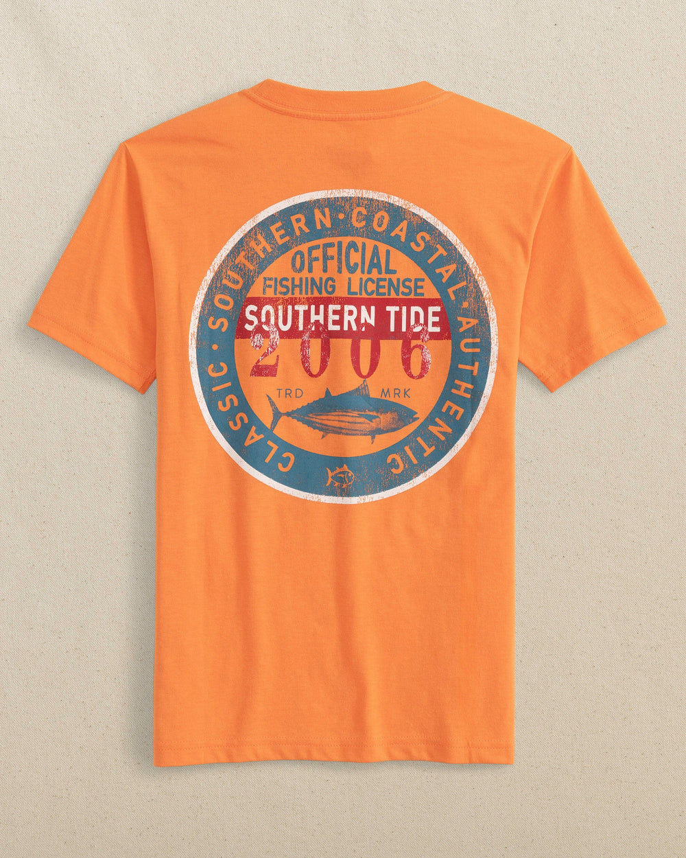 The back view of the Southern Tide Kids Official Fishing Badge Short Sleeve T-Shirt by Southern Tide - Papaya Orange