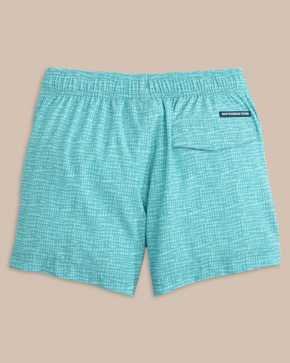 The back view of the Southern Tide Kids Painted Check Swim Trunk by Southern Tide - Wake Blue