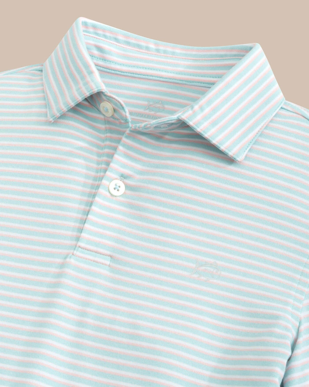 The detail view of the Southern Tide Kids Ryder Heather Halls Stripe Performance Polo by Southern Tide - Heather Wake Blue
