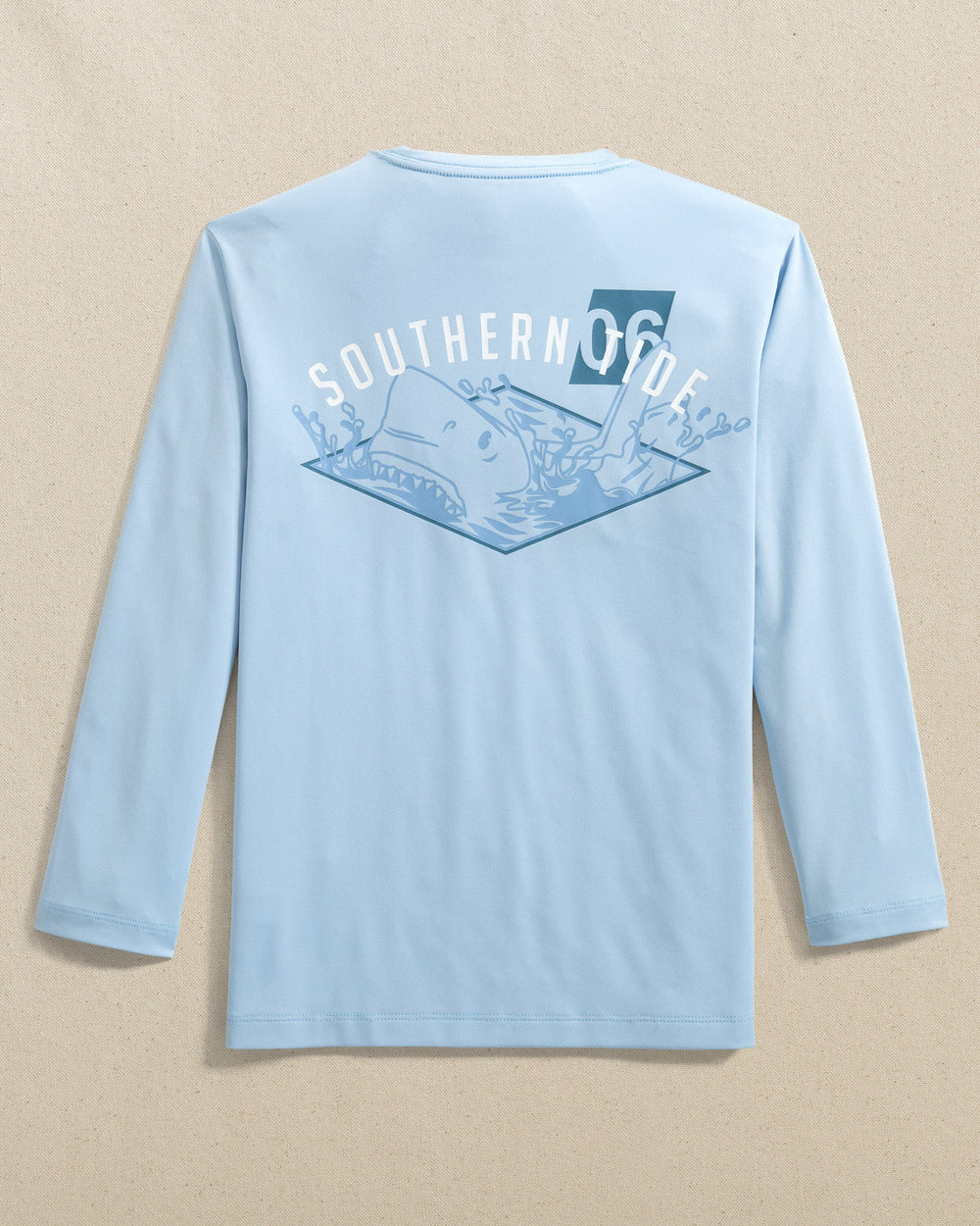 The back view of the Southern Tide Kids Shark Attack Performance Long Sleeve T-Shirt by Southern Tide - Cerulean