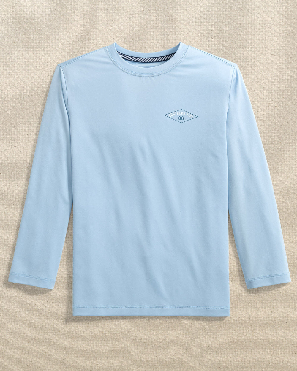 The front view of the Southern Tide Kids Shark Attack Performance Long Sleeve T-Shirt by Southern Tide - Cerulean