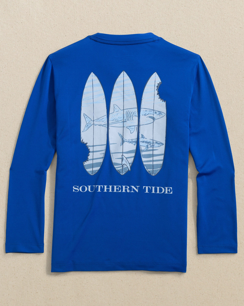 The back view of the Southern Tide Kids Shark Bite Surfboards Long Sleeve Performance T-Shirt by Southern Tide - Surf Blue