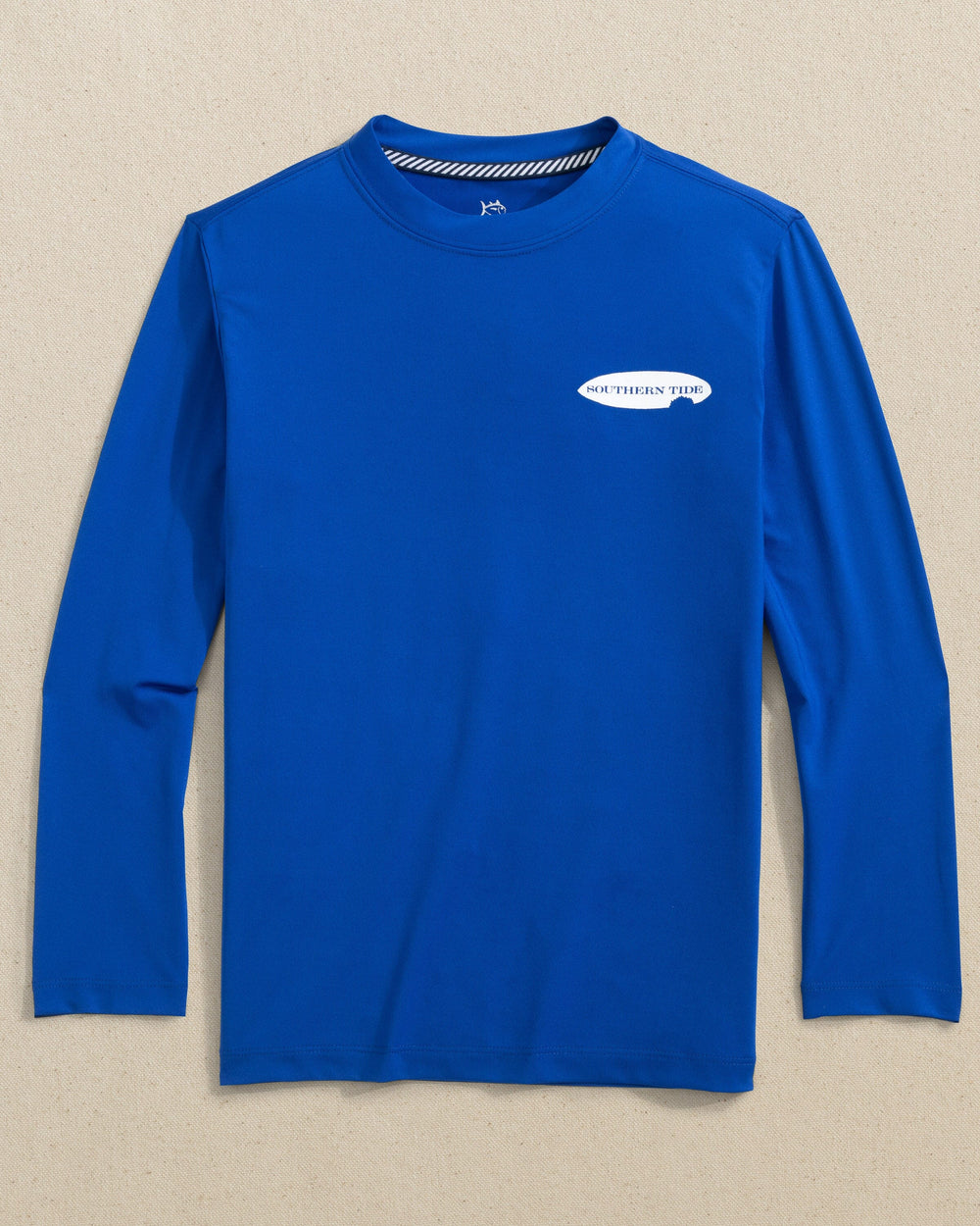 The front view of the Southern Tide Kids Shark Bite Surfboards Long Sleeve Performance T-Shirt by Southern Tide - Surf Blue